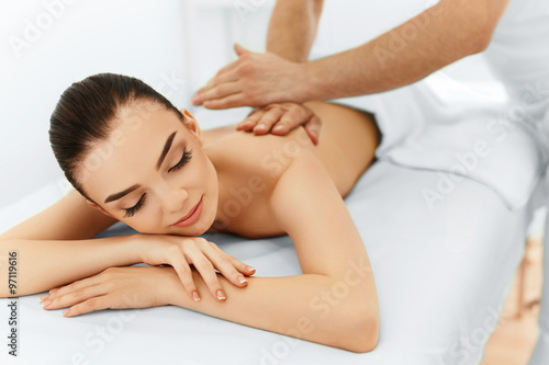 Body Care. Spa Woman. Beauty Treatment Concept. Masseur Doing Hand Massage On Relaxed Beautiful Young Caucasian Woman's Body In The Spa Salon. Skin Care, Wellness, Wellbeing.