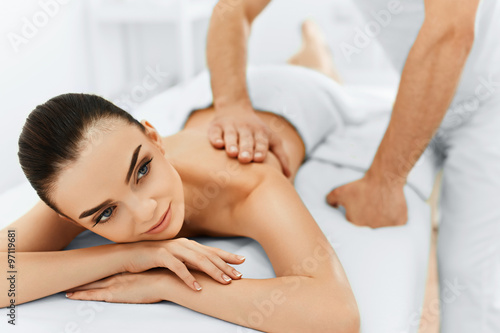 Body Care. Spa Woman. Beauty Treatment Concept. Masseur Doing Hand Massage On Relaxed Beautiful Young Caucasian Woman s Body In The Spa Salon. Skin Care  Wellness  Wellbeing.