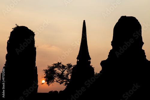 silhouette pagoda in Wat Mahathat temple at Ayutthaya, Thailand photo