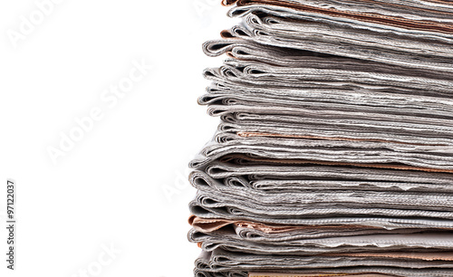 stack of daily newspapers