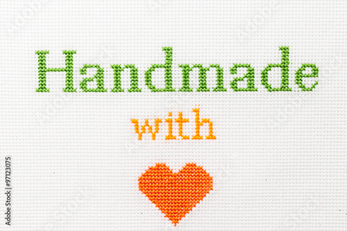 Handmade with love phrase embroidered cross stitch.  A series of embroidered titles #97123075
