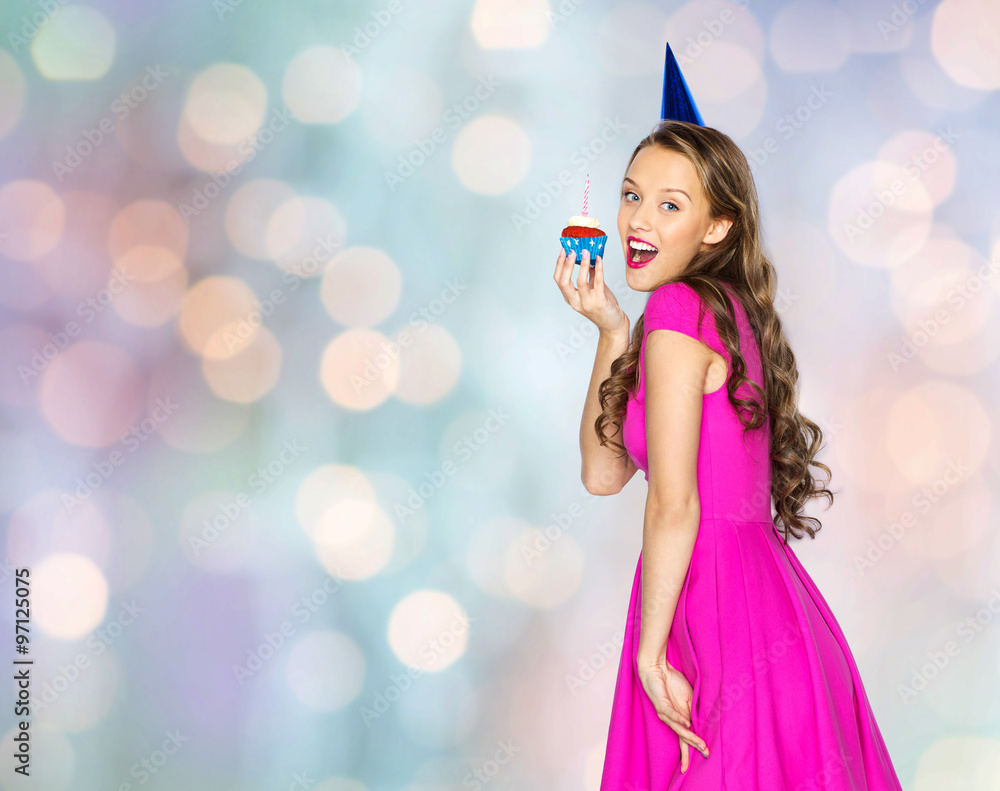 happy woman or teen girl with birthday cupcake happy woman or teen girl with birthday cupcake