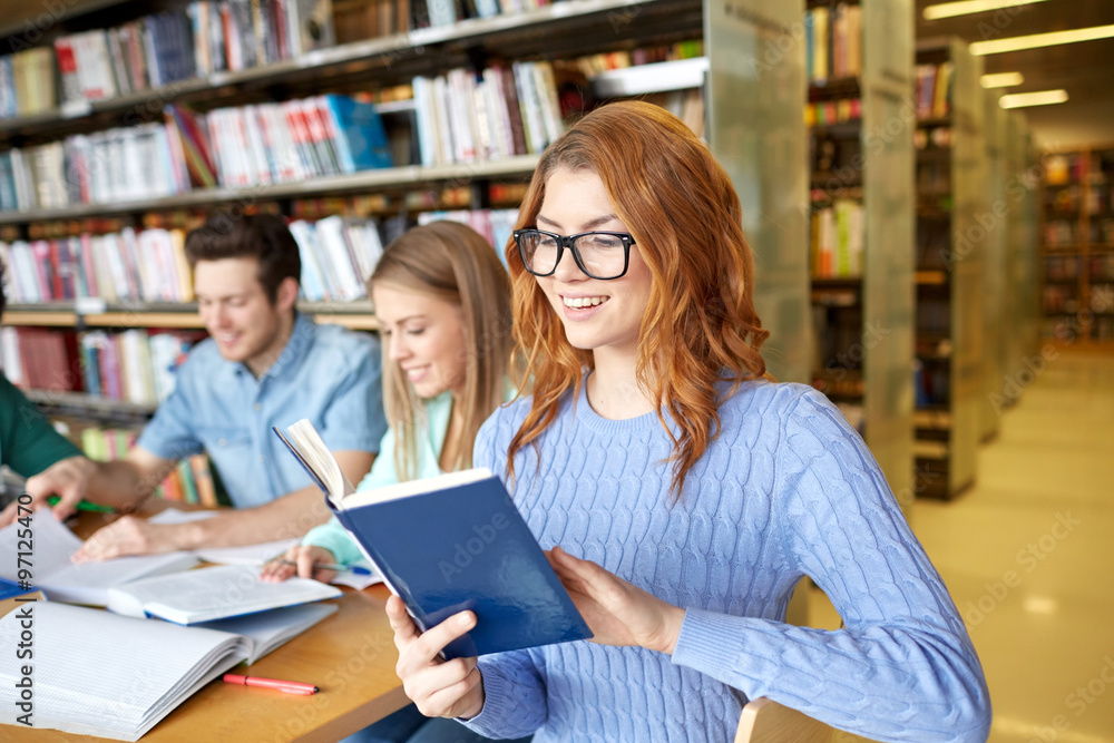 students with books preparing to exam in library students with books preparing to exam in library