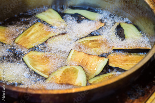 Eggplant is frying in a pan. Sicilian street food