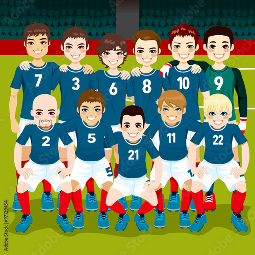 Full soccer blue team posing on soccer field ready to play