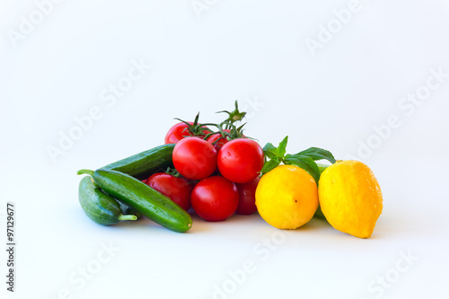 Vegetables in a wicker basket isolated on white background