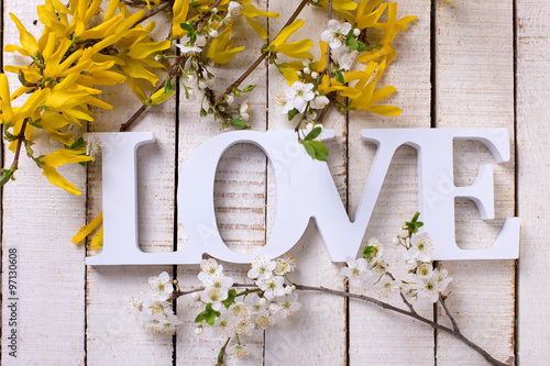 Word love and flowering branches with yellow and white flowers #97130608