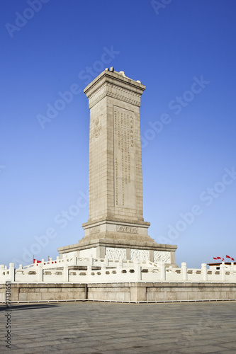 Commemoration monument Tiananmen Square Beijing against a blue sky