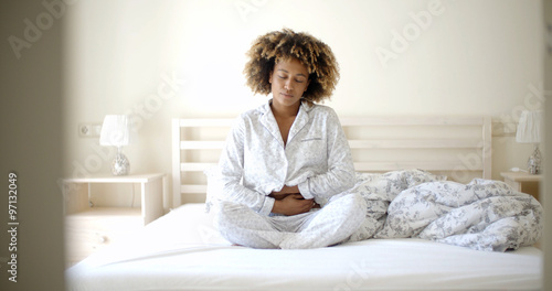 Fényképezés Girl With Stomach Ache Sitting On Bed