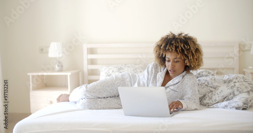 Girl Surfing On The Internet At Home