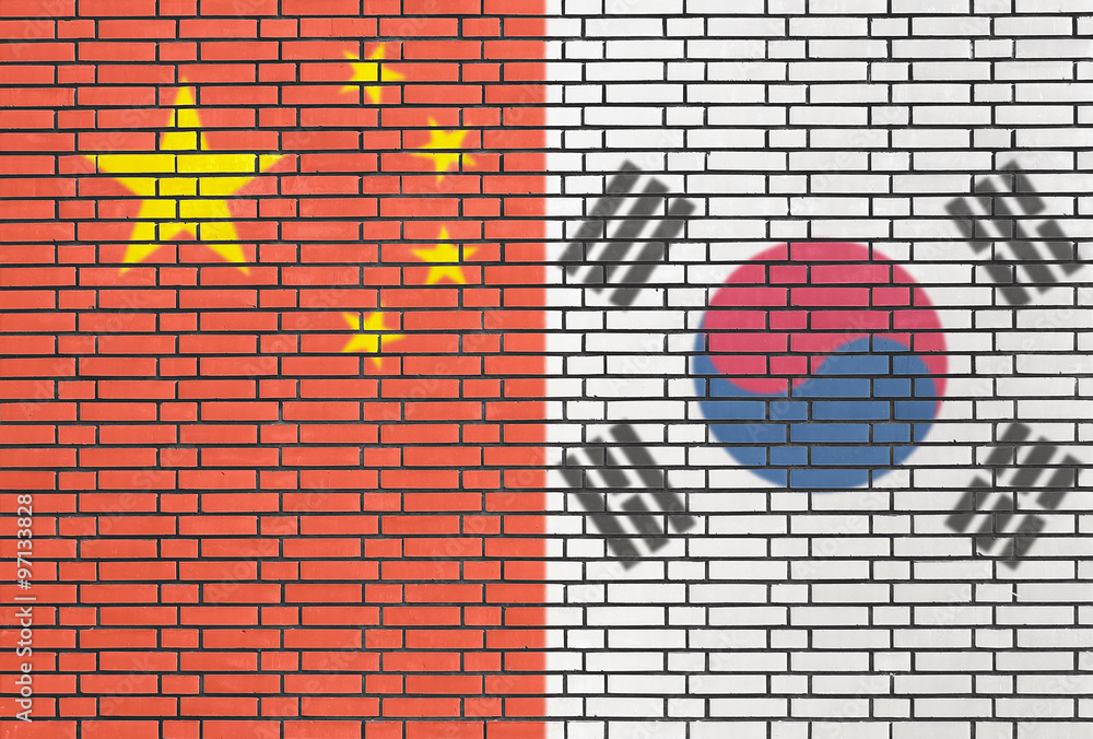 China and South Korea flags on a wall