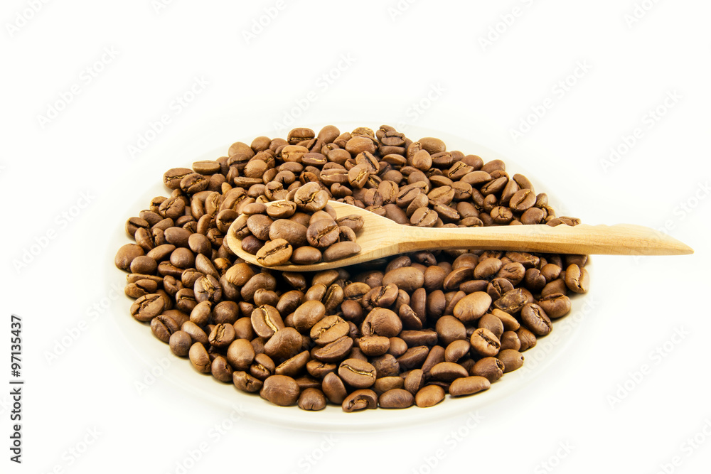Cup full of coffee beans isolated Cup full of coffee beans isolated