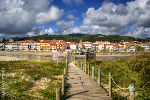 Boardwalk through the sand dunes on beach in Portugal © Vector