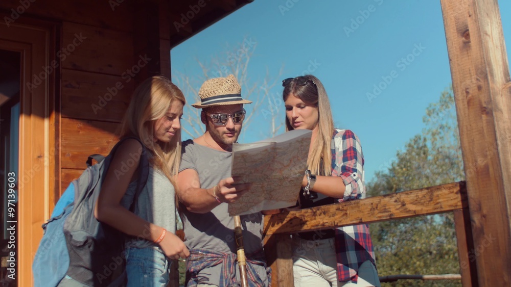 Handheld shot of friends checking map outdoors
Handheld shot of friends checking map outdoors