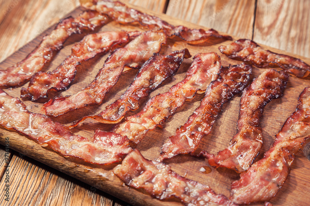 bacon on a wooden plate bacon on a wooden plate