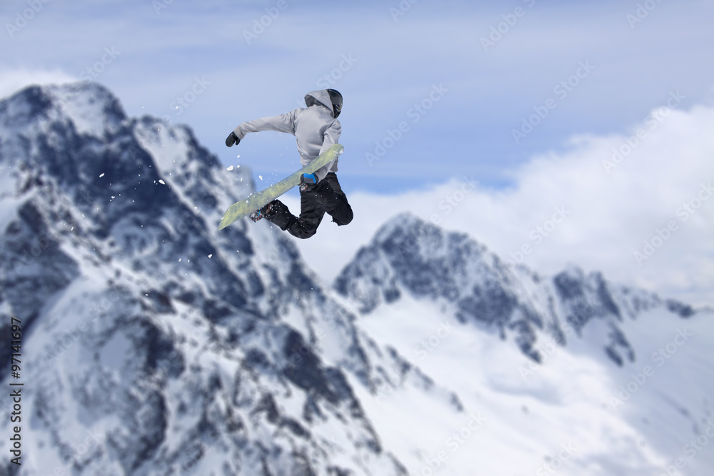 Flying snowboarder on mountains. Extreme sport. Flying snowboarder on mountains. Extreme sport.