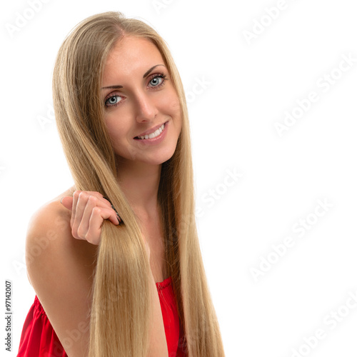 Portrait of a beautiful young smiling woman with luxurious long hair 