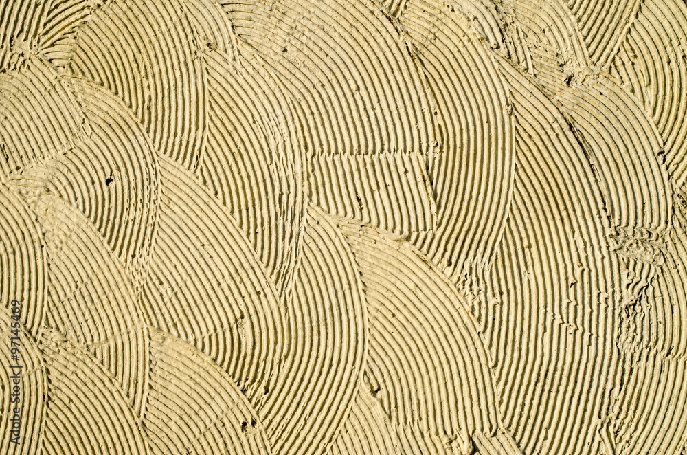 Yellow decorative relief plaster on wall Yellow decorative relief plaster on wall