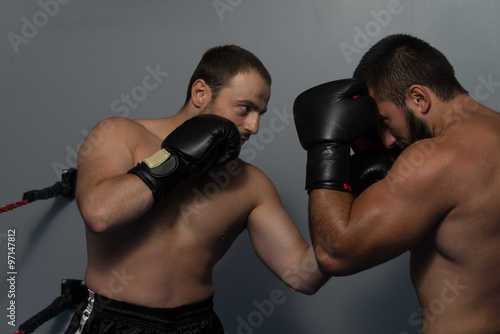 Mixed Martial Artists Fighting - Punching