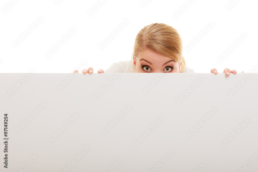 Businesswoman hiding behind blank copy space banner Businesswoman hiding behind blank copy space banner