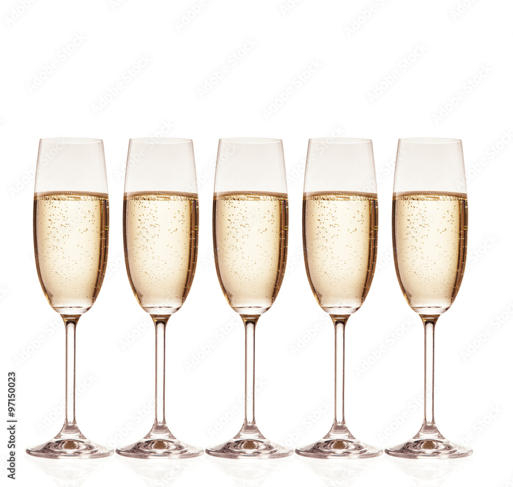 Glasses of champagne with bubbles, isolated on white