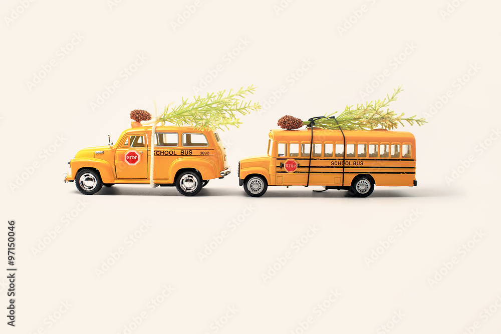 Obraz premium School buses toy model and Christmas tree.Christmas background w