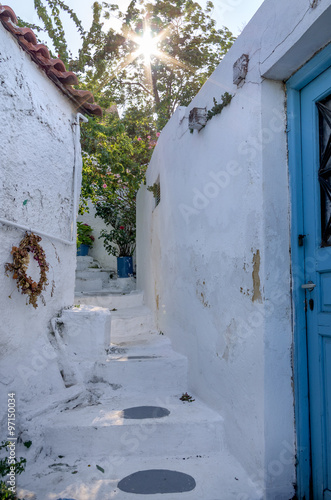 Street with old buildings in Anafiotika neighborhood in Plaka , Athens, Greece