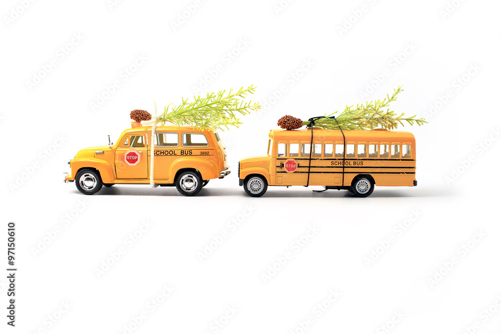School buses toy model and Christmas tree.Christmas background with Copyspace for text .