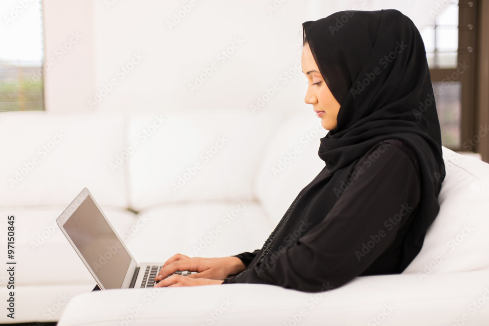 young middle eastern woman using laptop young middle eastern woman using laptop
