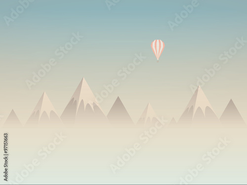 Low poly mountains landscape vector background with balloon flying above clouds or mist. Symbol of exploration, discovery and outdoor adventures