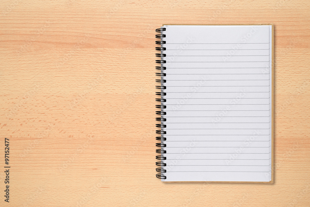 Notepad on office desk top view Notepad on office desk top view