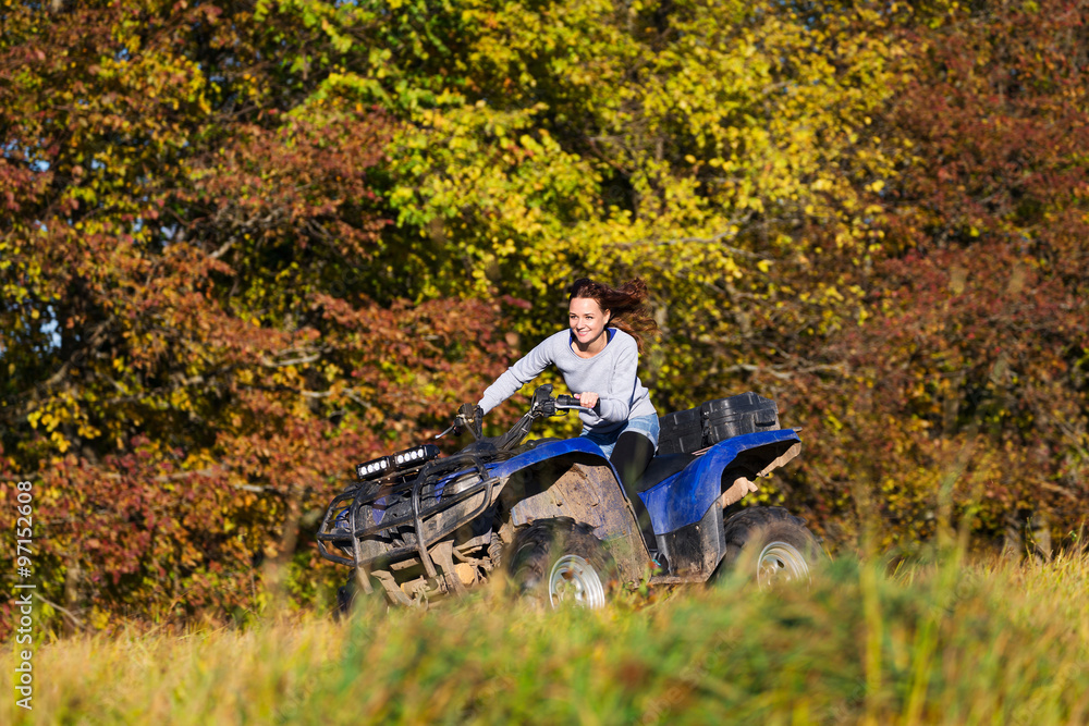 Elegant woman riding extreme quadrocycle ATV Elegant woman riding extreme quadrocycle ATV