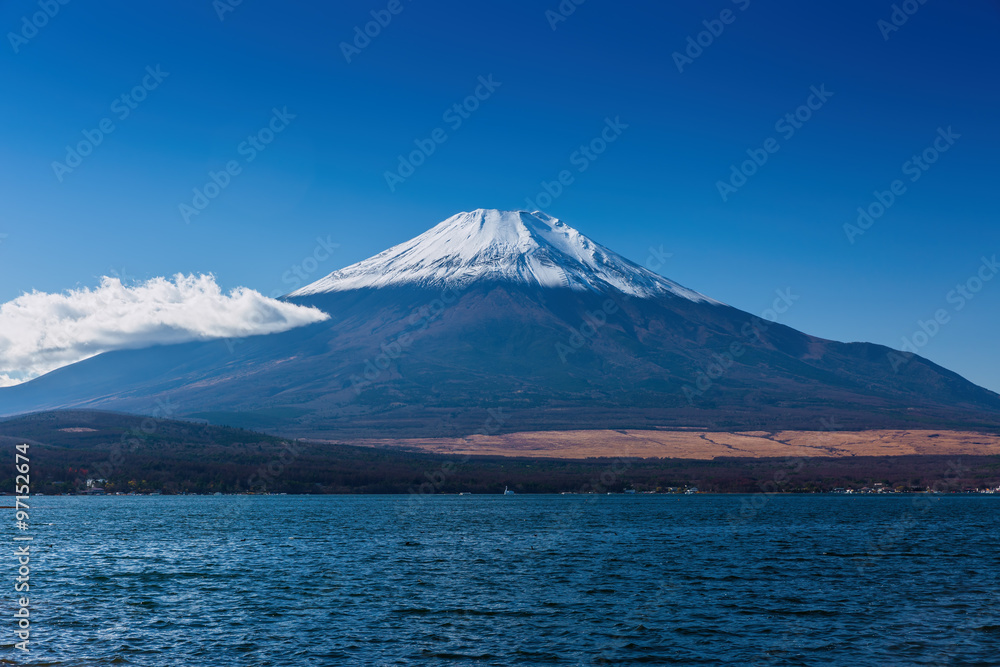 The sacred mountain of Fuji in the background of blue sky at Jap