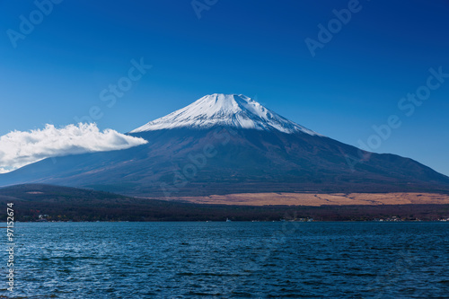 The sacred mountain of Fuji in the background of blue sky at Jap