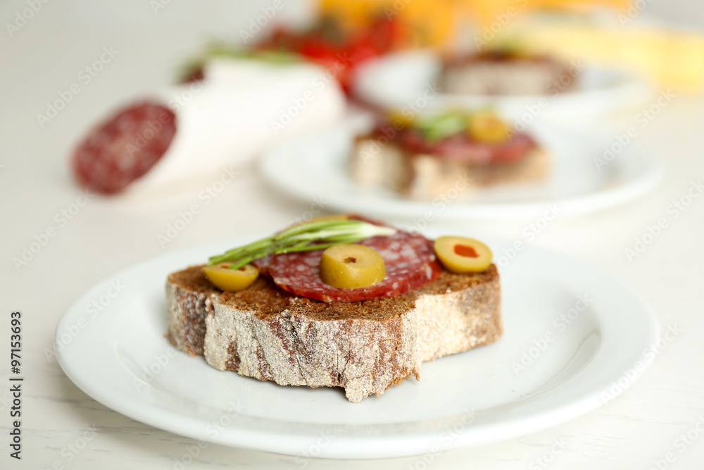 Tasty sandwiches on plates, close up