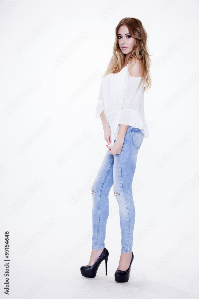 Young slim sexy woman in fashionable dress isolated on white bac