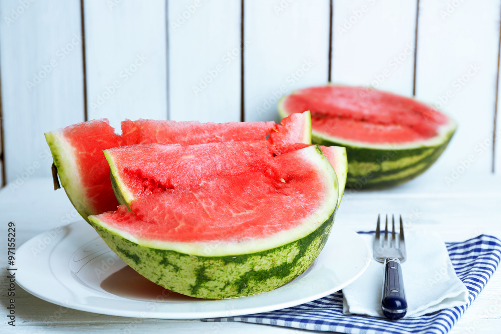 Sliced watermelon on white plate Sliced watermelon on white plate