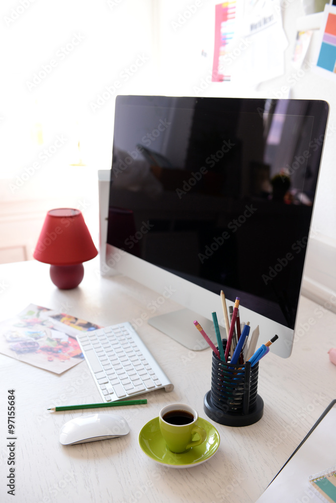 Modern computer on the table in decorated room