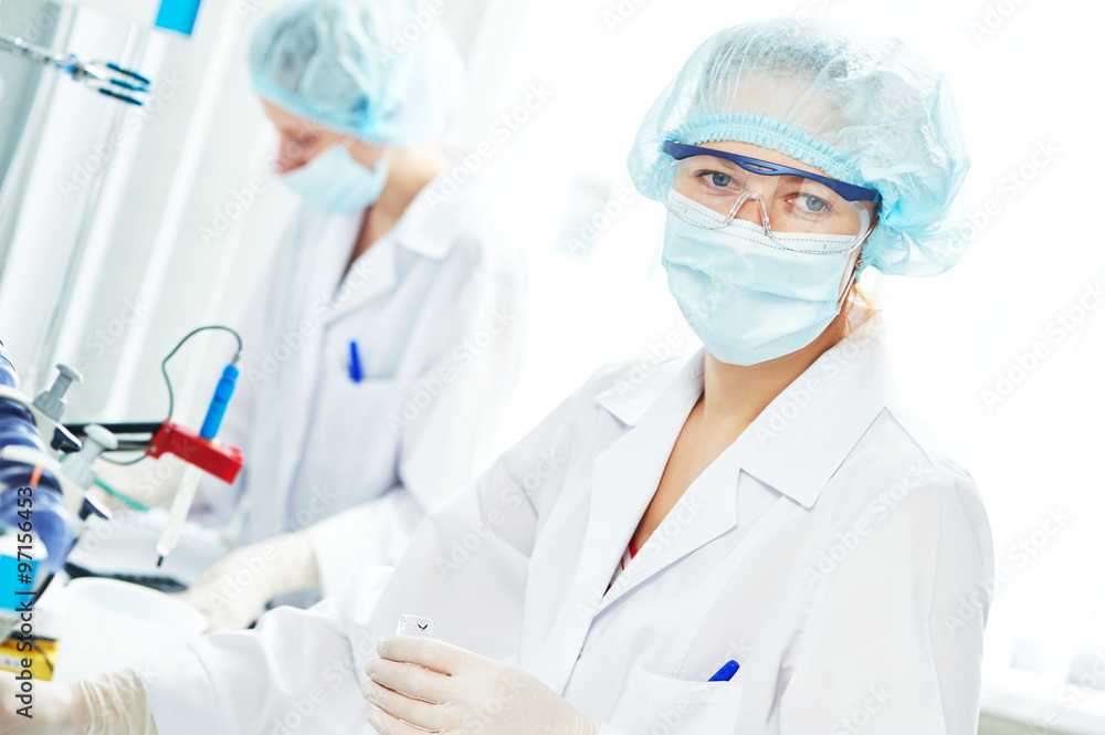 Female scientific researcher making medicine experiment Female scientific researcher making medicine experiment