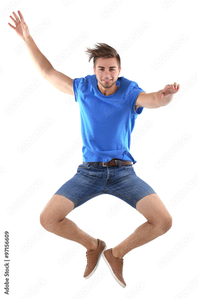 Active guy jumping in joy, isolated on white