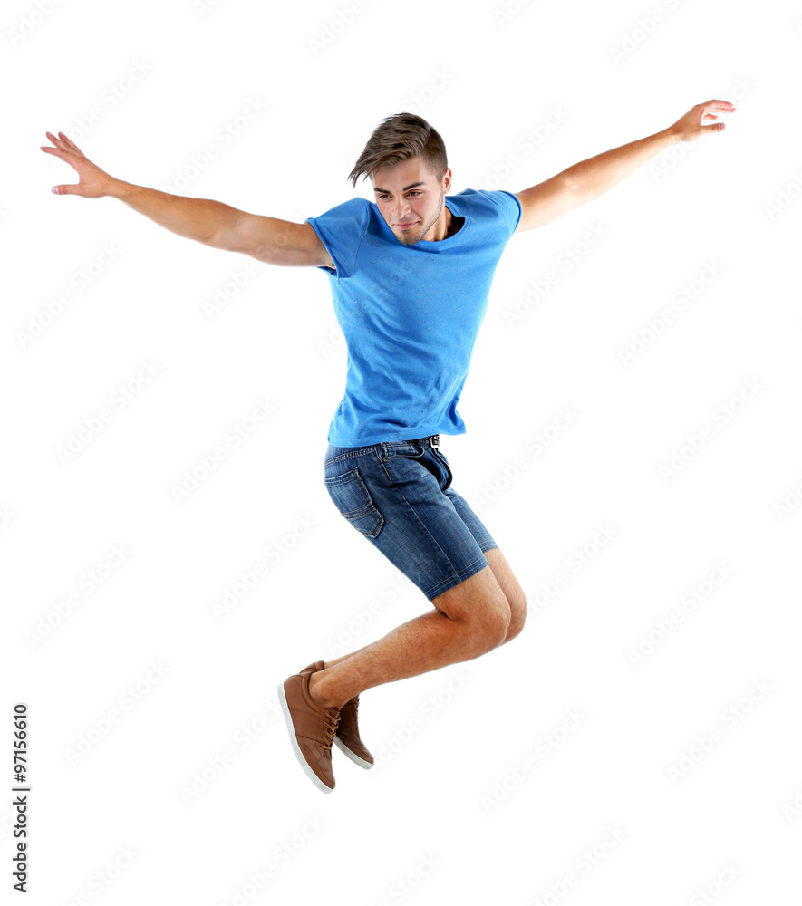 Active guy jumping in joy, isolated on white