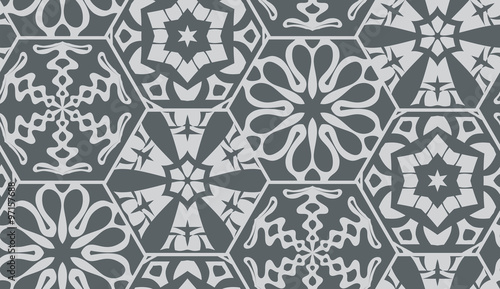 ector seamless background of hexagons decorated with patterns. Snowflakes and hexagons patterns. Gray geometrical seamless background.