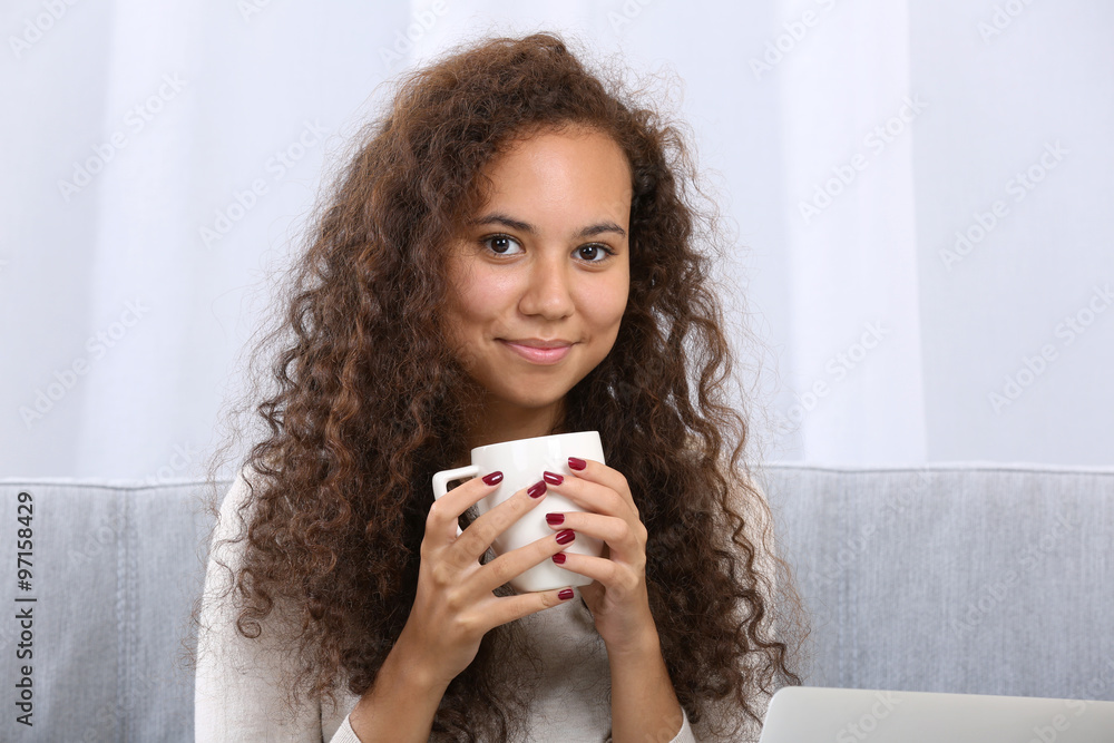 Close up portrait of pretty young women drinking coffee on white background Close up portrait of pretty young women drinking coffee on white background
