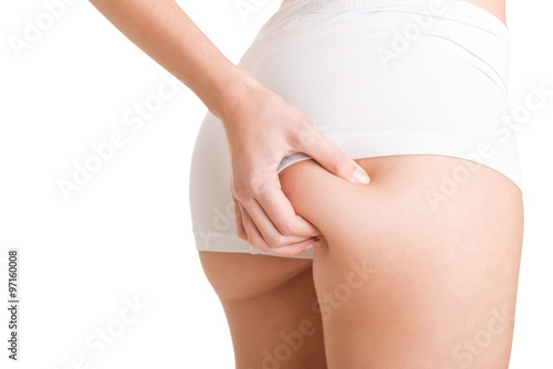 Woman Examining Her Buttocks for Cellulite