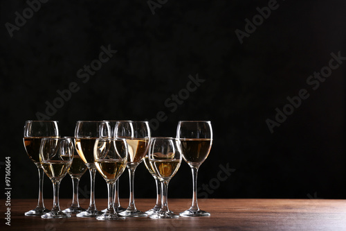 Half full wine glasses on a table