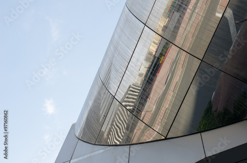 Sandy dirty dubai building with street reflection photo