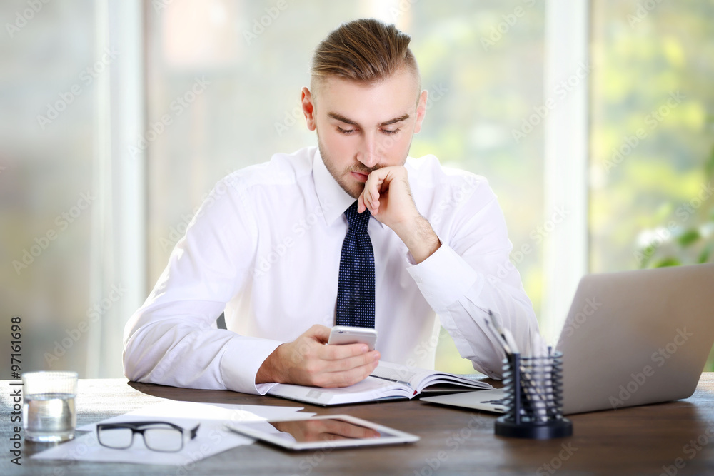 Businessman working with laptop in office Businessman working with laptop in office