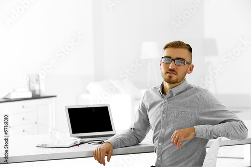Businessman working with la...