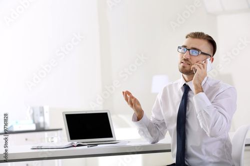 Businessman working with la...