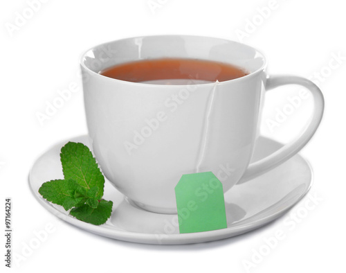Ceramic cup of tea with mint leaves isolated on white background